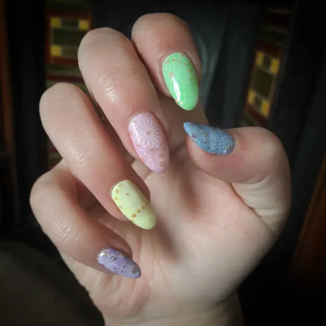My new spring nail set done by Pooja for me :) Done in with the stamping technic.